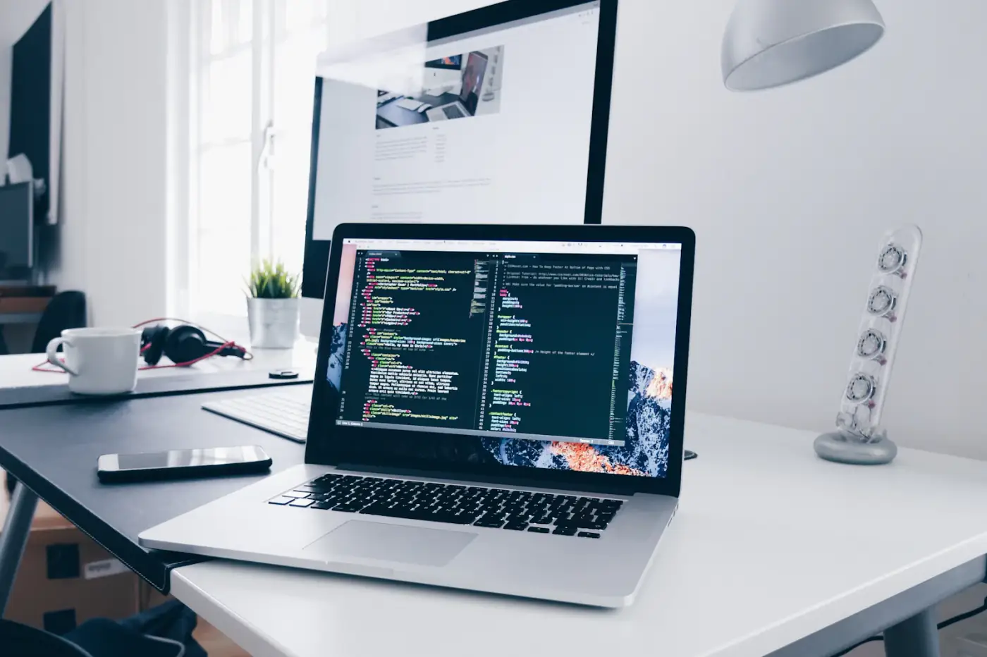 Developer working on a modern website at a laptop